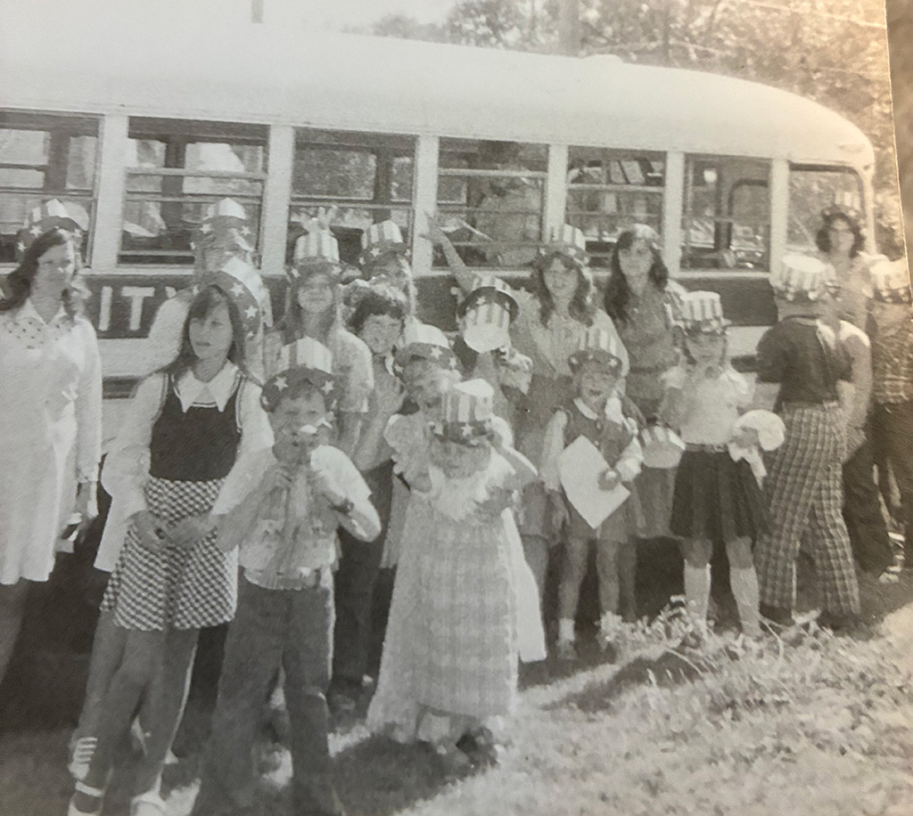 A group of children arrive to church as part of a bus ministry.