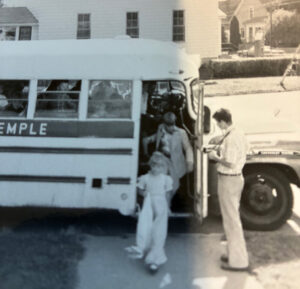 Children getting off the bus.